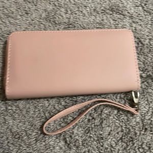 I am selling a wallet it is a light pink wallet